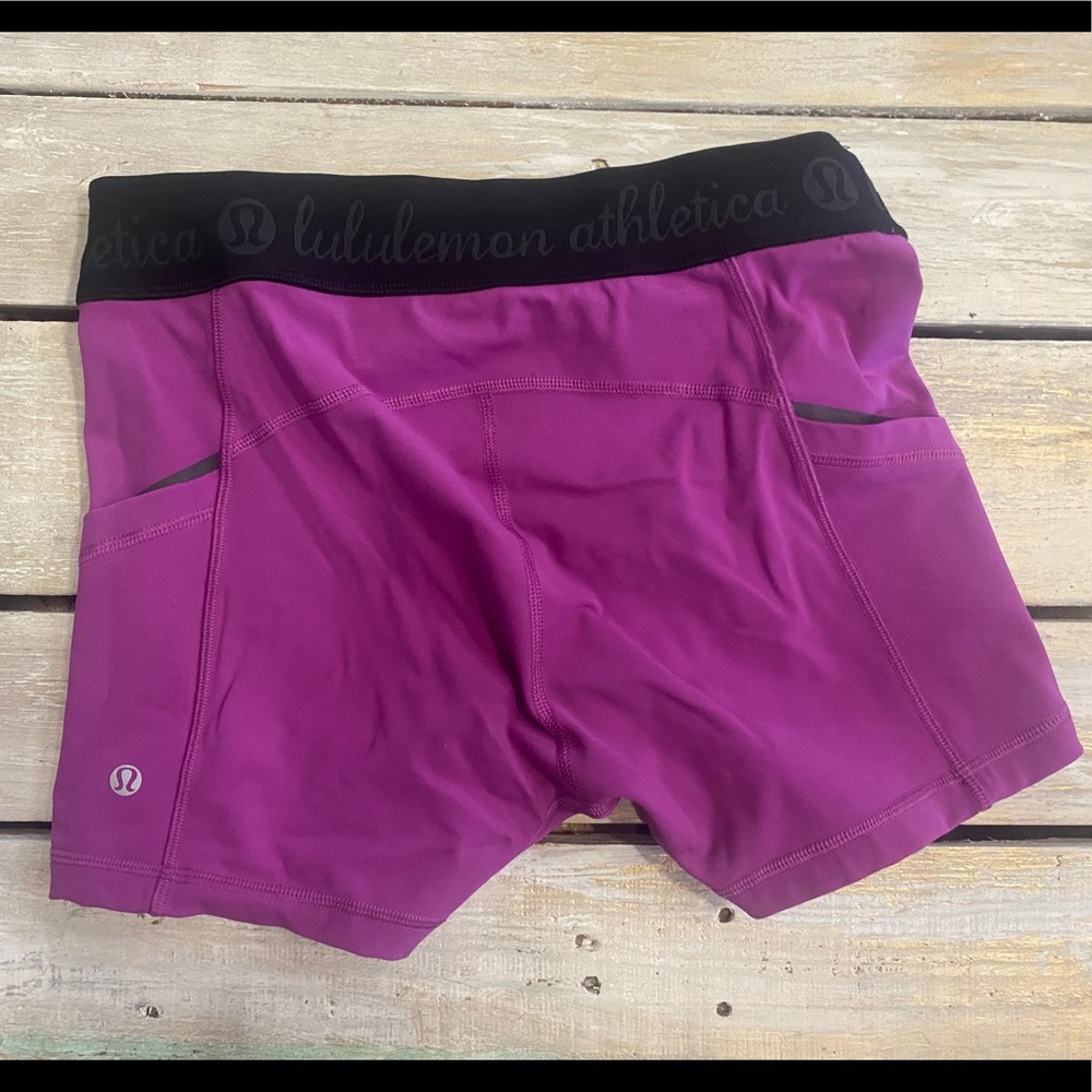 Lululemon pink/purple 2.5 inseam spandex shorts.